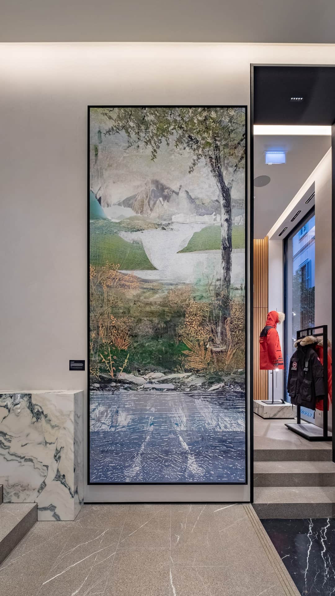 Entrance of Canada Goose, Milan with artworks by Qavavau Manumie and Alex Fischer